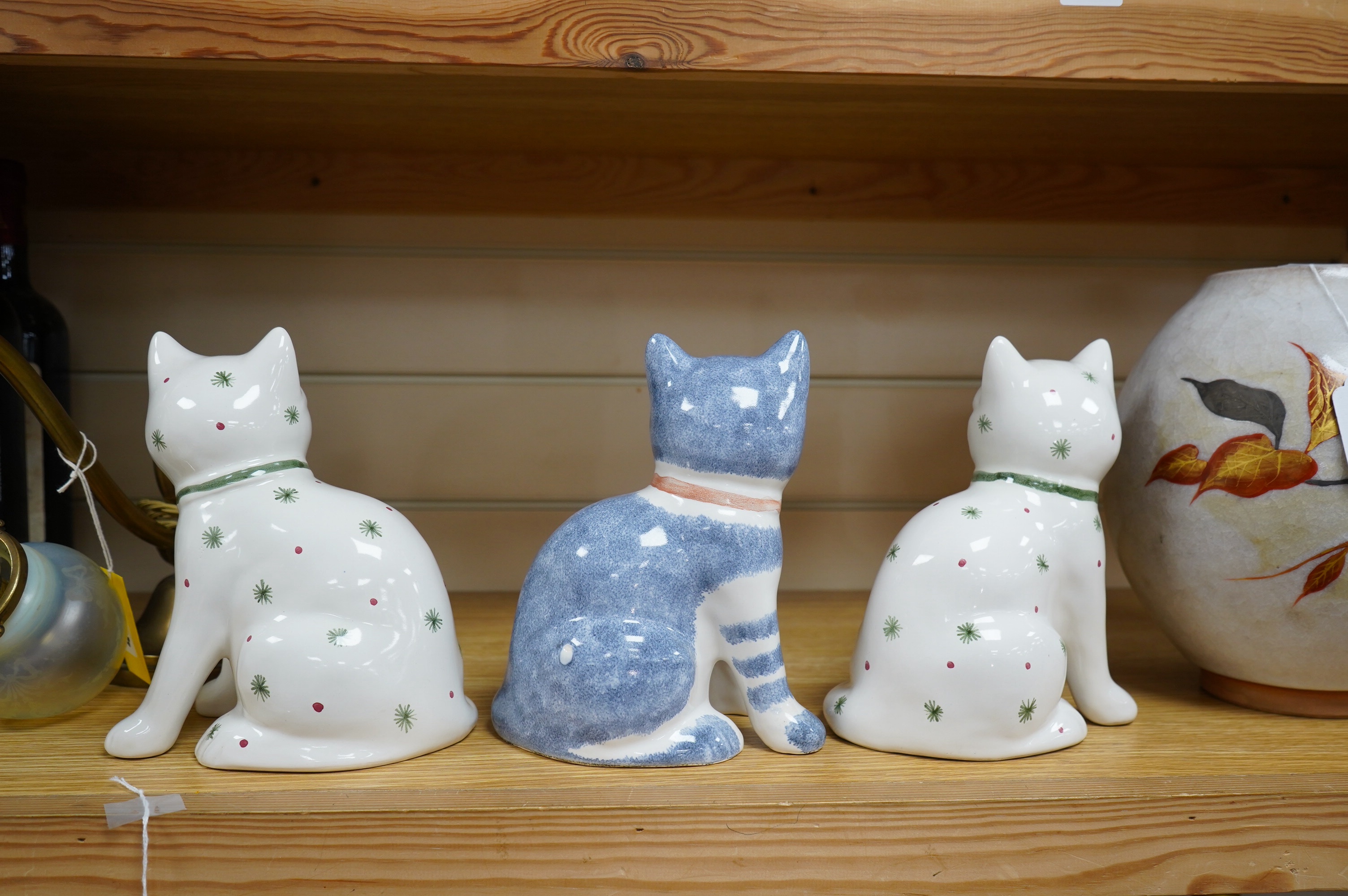 A pair of Rye pottery seated cats, and another, largest 19.5cm high. Condition - good